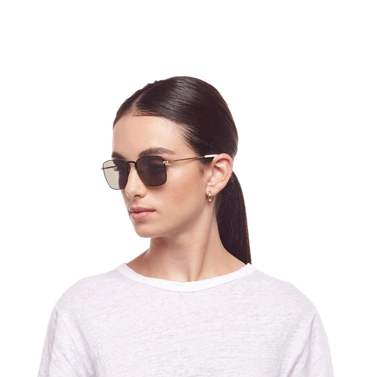 Le Specs Folsom – Noir / Or – verres verts – portées