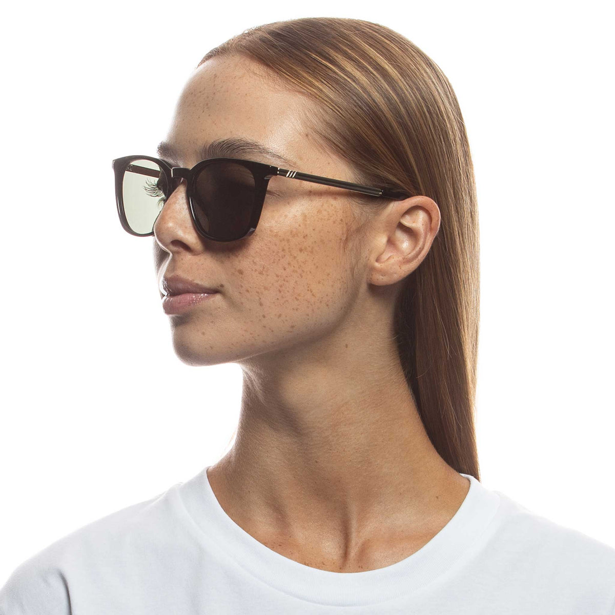 Le Specs Huzzah – Noir – verres verts – portées